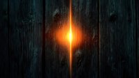 Glowing orange light beam piercing through dark wooden planks background, creating mysterious atmospheric effect with dramatic illumination.