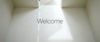 Bright minimalist white room with open door and Welcome text, sunlight on clean floor, conveying hospitality, new beginnings, and fresh start concepts.