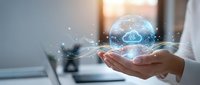Businessman holding holographic cloud computing network with digital data connections and glowing particles in modern office environment for technology solutions.