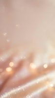 Soft blurred background with warm peachy and rose tones, featuring bokeh light effects and sparkling particles. Suitable for elegant designs, wellness, beauty, and lifestyle projects.