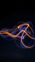 Abstract neon light trails creating flowing waves and curves against starry night sky background for digital art and technology concepts.