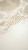 Luxurious cream silk fabric with elegant flowing drapes and soft natural lighting creating sophisticated textile background for fashion and interior design.