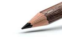 Sharp black graphite pencil tip macro shot on white background, showing wood texture and lead point detail, isolated for creative and educational designs.