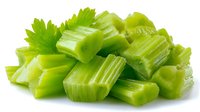 Fresh chopped celery stalks in bright green color isolated on white background, ready for cooking, salads, or healthy snacking.