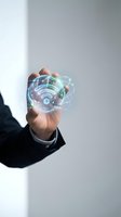 Businessman hand holding glowing wifi hologram with network connections and digital communication symbols for technology and internet concepts.