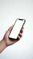 Hand holding black smartphone with blank white screen mockup isolated on white background for app presentation and digital marketing materials.