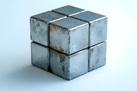 Weathered metal cube puzzle with rusty patina texture isolated on white background for industrial design concepts and problem solving themes.