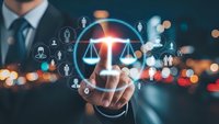 Professional businessman touching digital justice scales interface with network of people icons representing legal technology and law firm services.