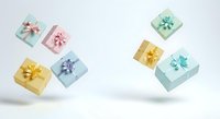 Colorful gift boxes with bows floating against white background, isolated presents in pastel colors for holiday, birthday, celebration designs and packaging concepts.