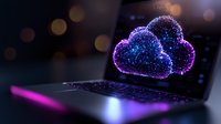 Glowing digital cloud symbol on laptop keyboard with purple and blue neon lights against dark background with bokeh effect. Cloud computing concept.