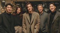 Happy Asian business team celebrating success in modern office with festive decorations during holiday season corporate party event.