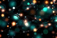 String lights with glowing turquoise and orange bokeh effects against dark background create magical holiday atmosphere for festive designs and decorations.