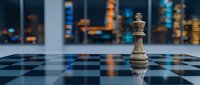 Wooden chess piece queen standing alone on checkered board with blurred city skyline lights in background, representing strategy, leadership, and business planning.