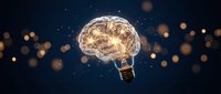 Creative brain lightbulb concept with glowing neural networks on dark background with bokeh lights for innovation and idea generation projects.