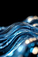 Flowing water streams with dynamic wave motion and bokeh light effects against dark background, suitable for technology, innovation, and fluid dynamics concepts.