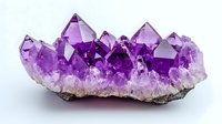 Raw amethyst crystal cluster formation showing deep purple points and crystalline structures emerging from white quartz base on neutral background.