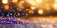 Colorful glitter scattered on reflective surface with golden bokeh background creates magical festive atmosphere. Macro photography captures sparkling celebration moment.