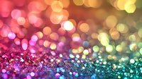 Abstract colorful bokeh background with glittering sparkles transitioning from pink to green, perfect for festive celebrations and holiday designs.
