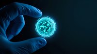 Scientist in blue gloves holding glowing cell or virus structure for medical research and biotechnology applications on dark background.