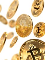 Golden cryptocurrency coins floating on white background with selective focus on central coin showing digital currency symbol and detailed relief pattern.