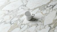 White ceramic mug on marble surface for product mockup, branding, and design presentations. Isolated cup on elegant stone background.