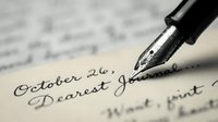Fountain pen writing cursive text on aged letter paper with selective focus on nib and ink, suitable for correspondence, writing, and vintage communication concepts.