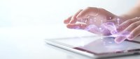 Hands protecting digital network connections above tablet device with glowing purple light effects representing cybersecurity and data protection technology.