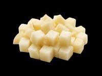 Diced white cheese cubes isolated on transparent background, ready for culinary design, food packaging, recipe graphics, cooking blogs, restaurant menus, and print-on-demand food illustrations.