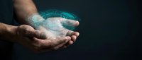 Male hands holding glowing digital holographic sphere with futuristic technology interface on dark background for business innovation concepts.