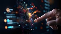 Male finger touching glowing digital particles with orange and blue bokeh lights creating magical effect against dark background. For technology concepts.