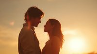 Romantic couple silhouette embracing at golden sunset, intimate moment between young man and woman against warm sky for love and relationship concepts.