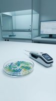 Modern laboratory workspace with digital glucose meter and petri dish containing bacterial cultures on white desk for medical research and diagnostics.