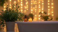 Relaxing spa bathroom setting with white bathtub, glowing candles, potted eucalyptus plant and warm fairy lights creating romantic atmosphere for wellness and self-care.