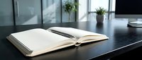 Open notebook with pen on modern office desk workspace for business planning and note-taking in contemporary professional environment.