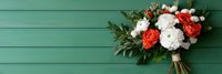 Wedding bouquet with white and coral roses on mint green wooden background for bridal photography and romantic celebrations.