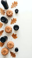 Autumn flat lay with orange pumpkins, black candles and dried oak leaves on white background. Seasonal home decor arrangement for fall holidays and cozy atmosphere.