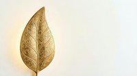 Golden ornate leaf with intricate carved patterns and decorative swirls on neutral background for luxury design projects and elegant branding materials.