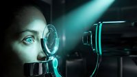 Woman with light skin tone and blue eyes examining futuristic holographic interface with glowing cyan light rays, representing technology, innovation, and digital vision for corporate and tech industry applications.