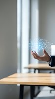 Businessman in dark suit holding hand above wooden table with glowing digital network icons and data visualization symbols floating in air, representing technology, connectivity, and business innovation in modern office setting.