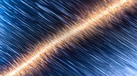 Diagonal light streak with glowing orange energy beam cutting through dynamic blue motion lines creates dramatic technological abstract background effect.