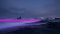 Bioluminescent waves glow with vibrant magenta and purple light along a rocky coastline at dusk, creating a surreal nighttime seascape with glowing water and dark silhouetted rocks.