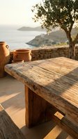 Rustic wooden table on Mediterranean terrace with clay pottery, olive tree, and coastal seascape at golden hour, ideal for travel and lifestyle design.