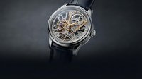 Luxury skeleton watch with exposed mechanical movement and black leather strap on dark background for premium timepiece advertising and jewelry marketing.