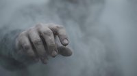 Mysterious hand emerging from thick fog or smoke creating dramatic atmospheric effect for horror thriller or supernatural themed projects.