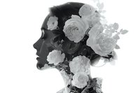 Woman silhouette profile with blooming roses and flowers in monochrome black and white artistic double exposure composition for beauty and wellness designs.