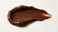Chocolate spread smear isolated on white background, ready for design use on packaging, advertising, and culinary marketing materials.