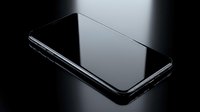 Modern black smartphone with glossy screen lying on dark surface with dramatic lighting and reflections for technology and communication concepts.