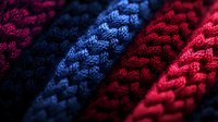 Colorful knit fabric textures in magenta, blue and red tones showing detailed weave patterns and stitching for textile, fashion and material design projects.