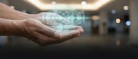 Mature male hand holding glowing digital globe hologram in modern office environment, representing global business, technology innovation, and worldwide connectivity solutions.