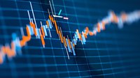 Financial market chart showing orange and white candlestick patterns against blue digital background, illustrating stock price movements and trading analysis.